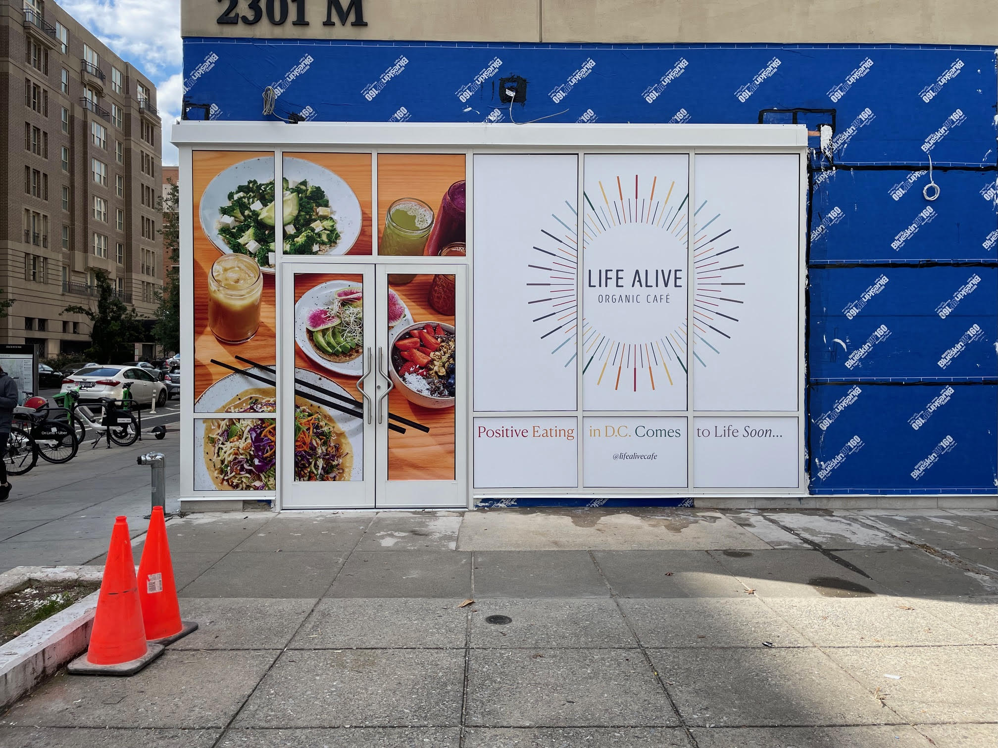 Food photography and Life Alive branding covering restaurant windows.