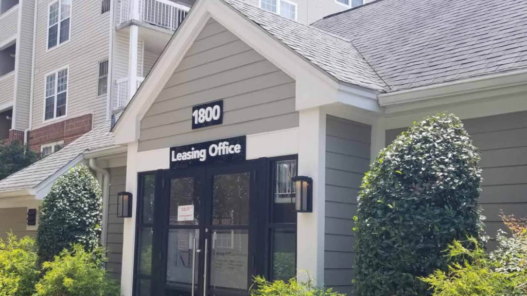 Rosslyn Heights leasing office sign above a building entrance.