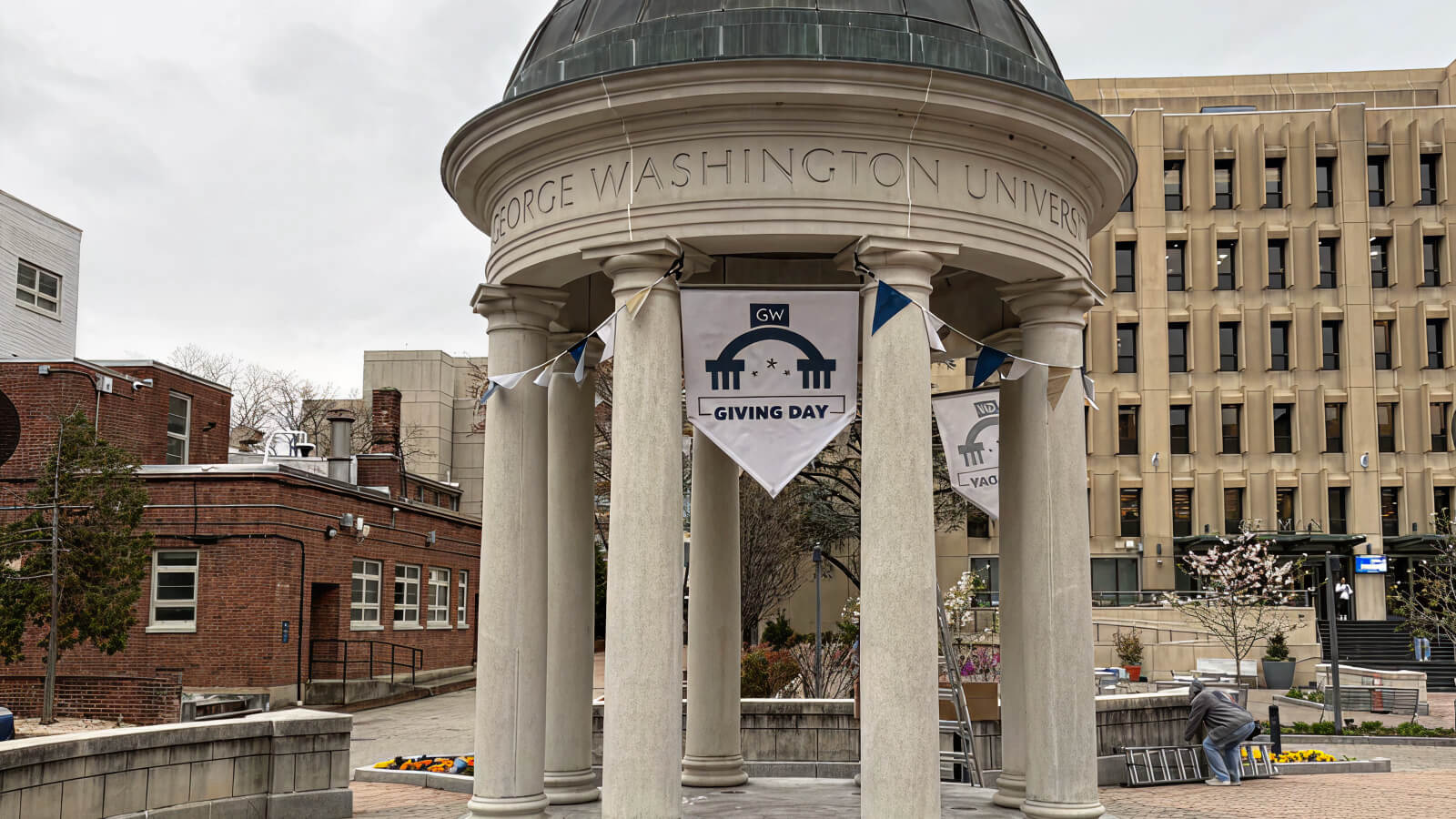 George Washington University banners mounted around an outdoor pavilion.
