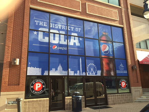 The District of Cola Pepsi graphics covering arena storefront windows.