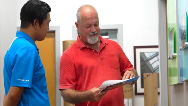 EPI-Colorspace team members reviewing a printed sample together.