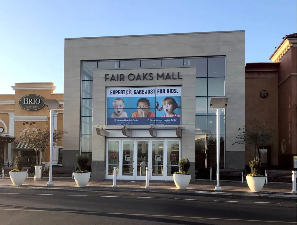 Promotional graphics above the entrance to Fair Oaks Mall.