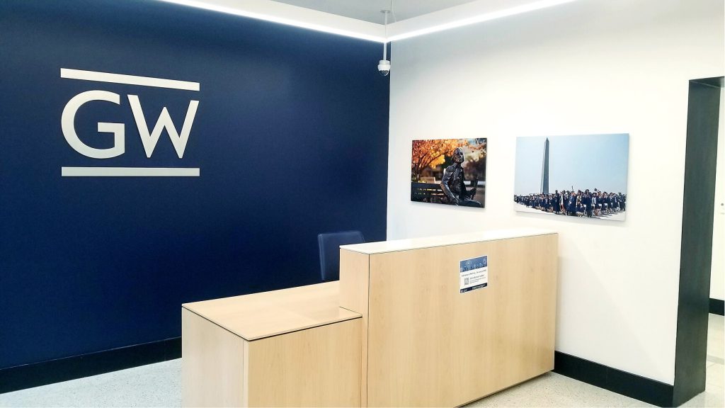 George Washington University logo above a reception desk.